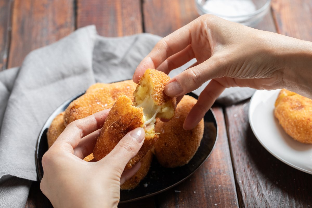 Potato croquettes with a cheesy mozzarella and ham center