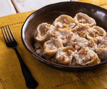 Ricotta and herb ravioli with walnut sauce