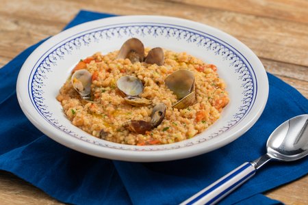 Fregola with clams and cherry tomatoes