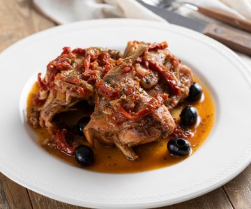 Braised rabbit with sun-dried tomatoes and olives