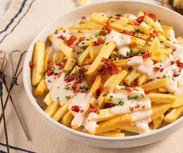 French fries with pecorino fondue and bacon