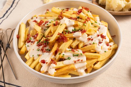 French fries with pecorino fondue and bacon