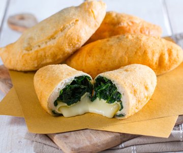Mini calzones with tomino cheese and spinach