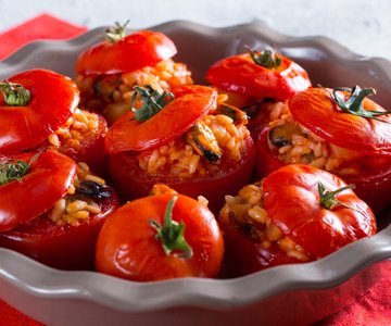 Stuffed tomatoes with rice, potatoes, and mussels
