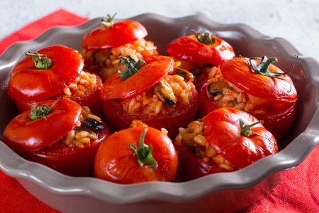 Stuffed tomatoes with rice, potatoes, and mussels
