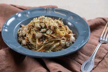 Spaghetti with mullet, almonds, and fennel