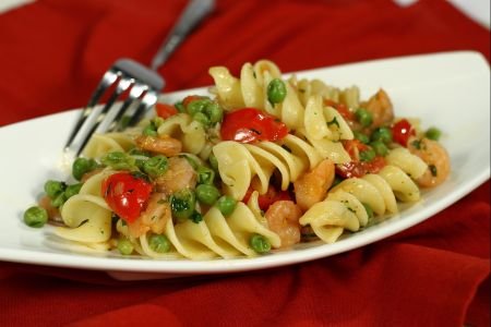 Fusilloni with peas, shrimp, and cherry tomatoes