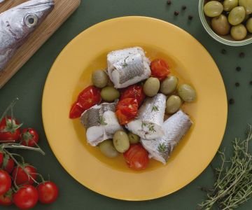 Steamed cod with green olives and cherry tomatoes