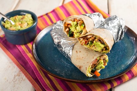 Tortillas with spiced pork and yogurt guacamole