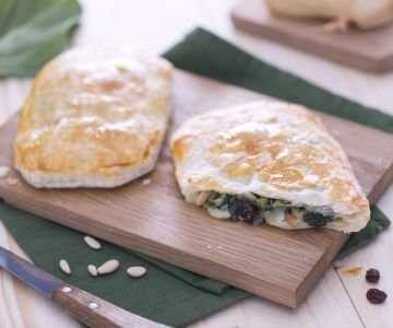 Puff pastry filled with chard, pine nuts, and raisins