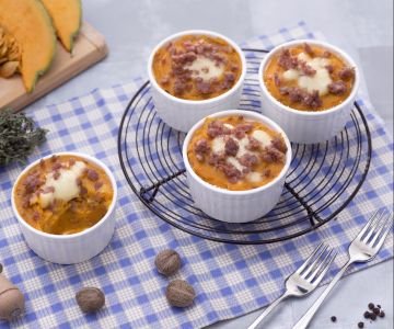 Single-serving gratin of potatoes, pumpkin, and sausage