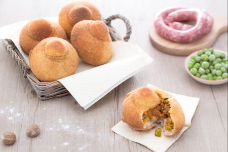 Rizzuole with ragù, béchamel, and peas