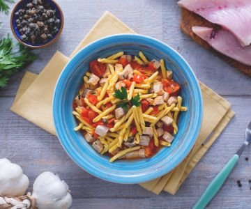 Strozzapreti with swordfish, cherry tomatoes, and capers