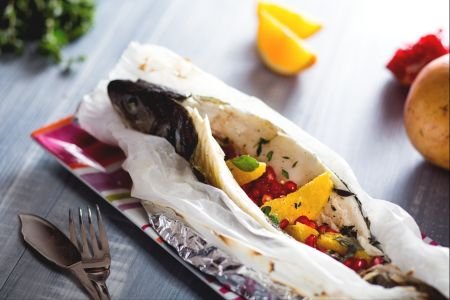 Sea bass en papillote with citrus and pomegranate