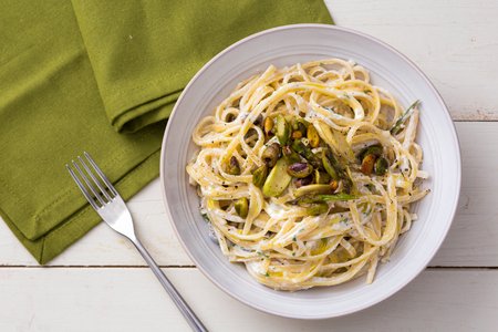 Pasta with ricotta cream, asparagus, and pistachios