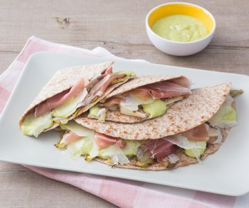 Flatbread with prosciutto, fava bean pesto, and endive