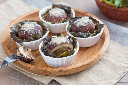 Vine leaf baskets with porcini mushrooms and Grana Padano