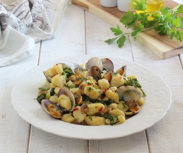 Gnocchi with clams and turnip tops