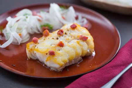 Cod in a pan with fennel and bacon salad