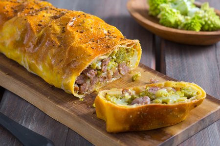 Savory strudel with Asiago PDO, broccoli, and sausage