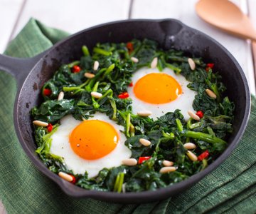 Broccoli rabe and eggs in a pan