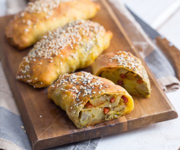 Savory mini strudels with artichokes, potatoes, and speck