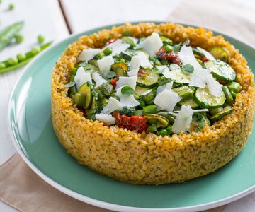 Rice pie with peas, asparagus, and zucchini