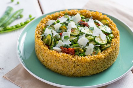 Rice pie with peas, asparagus, and zucchini