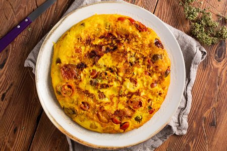 Omelette with cherry tomatoes and pecorino