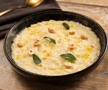 Orzo with leeks, robiola cheese, and hazelnuts