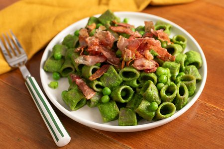 Buckwheat pasta with pea cream and crispy speck