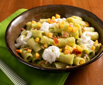Cold pasta with zucchini cream, peaches, and stracciatella