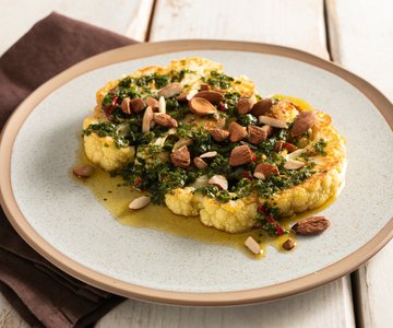 Roasted cauliflower with almonds and green sauce