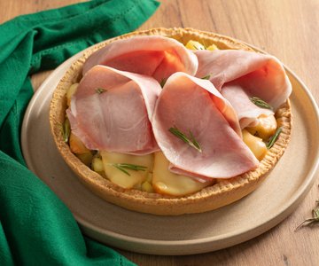 Savory tart with ham, smoked cheese, and potatoes