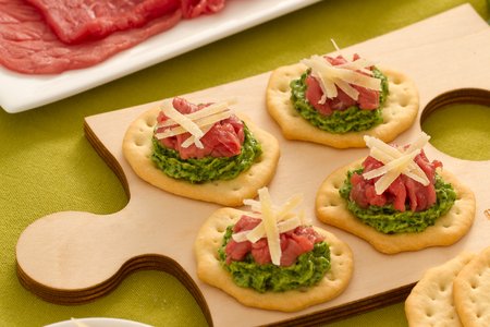 Flatbreads with beef carpaccio, arugula, and Sbrinz