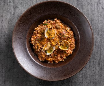 Fregula with clams and bottarga