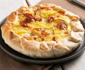 Savory tart with speck and potatoes
