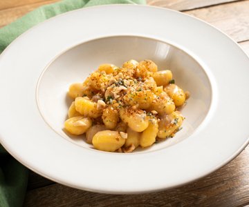 Gluten-free gnocchi with butter, anchovies and herbs
