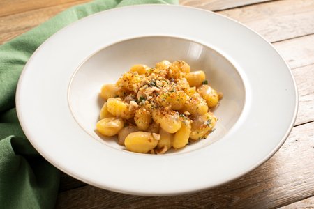 Gluten-free gnocchi with butter, anchovies and herbs