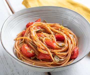 Spaghetti with cherry tomatoes and caperberries